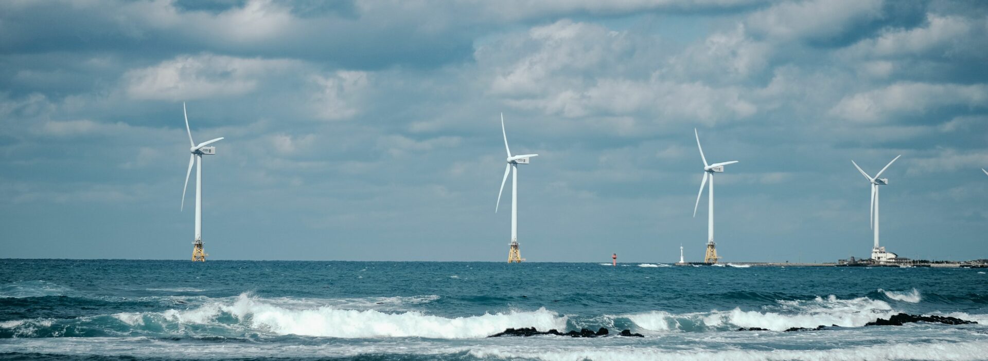 An image of a wind turbine farm offshore